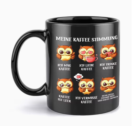 Schwarze Kaffeetasse mit Eulenmotiv